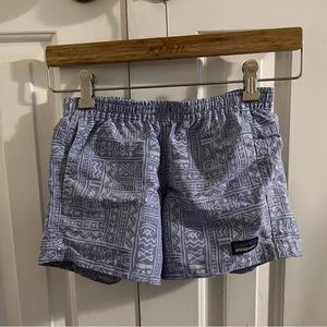 Youth Patagonia baggies, lavender and white in youth size medium.